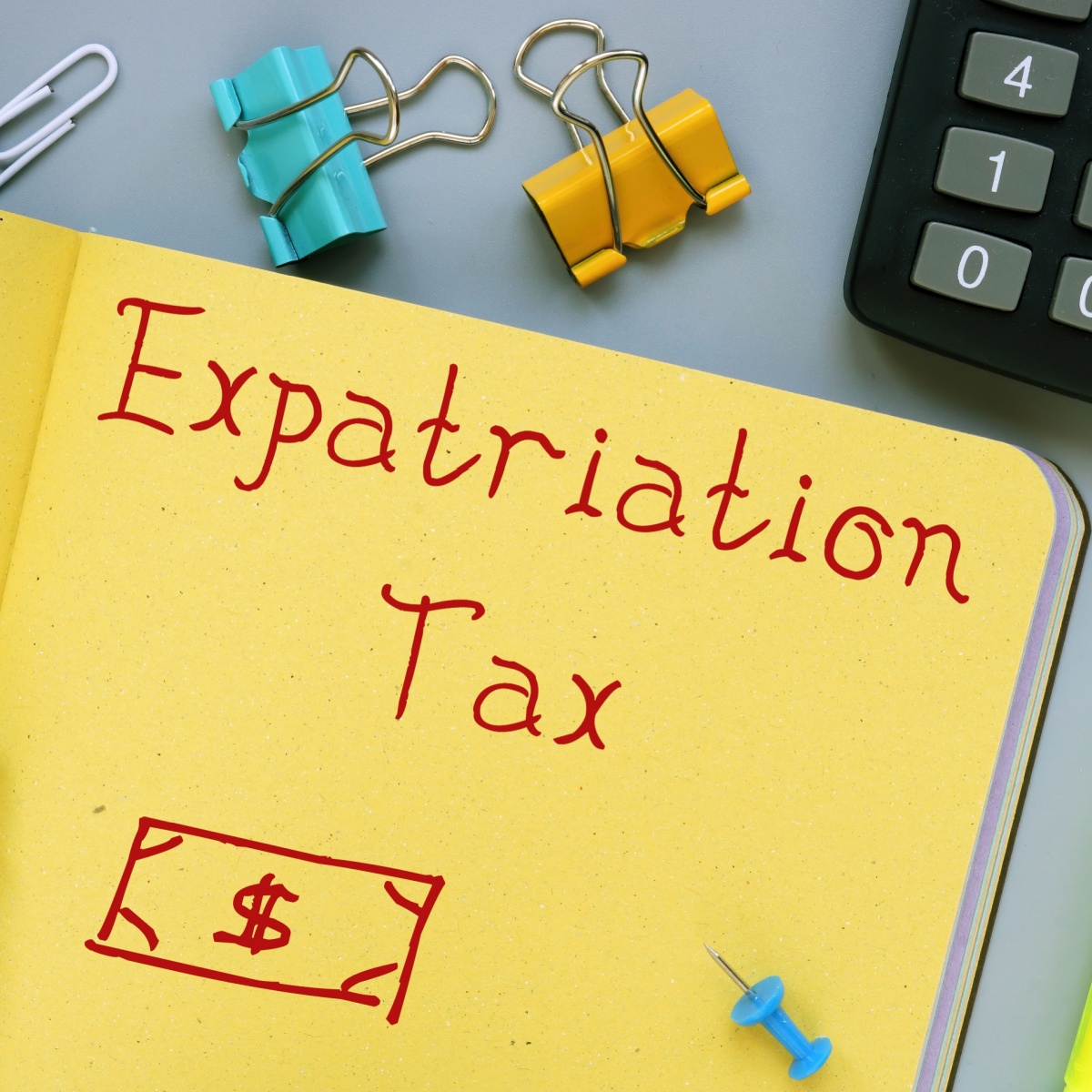 Note reading “Expatriation Tax” next to a calculator, illustrating tax planning issues for impatriates and self-employed professionals in Spain